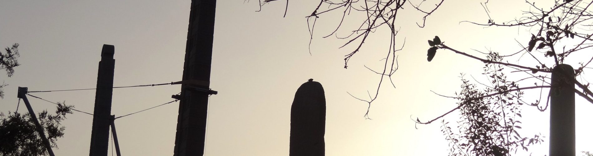 Ancient granite stelae of Aksum's Main Stelae Field silhouetted at sunset